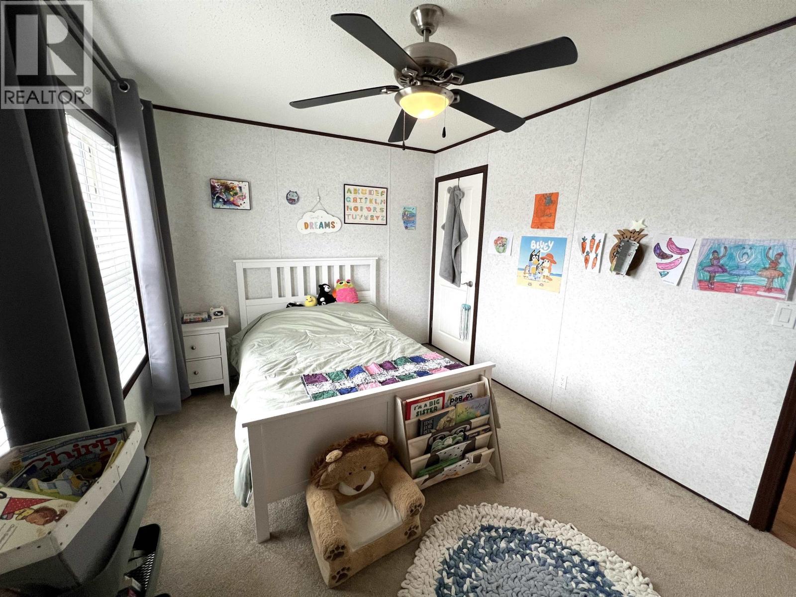 5506 Pine Crescent, Fort Nelson, BC - Indoor Photo Showing Bedroom