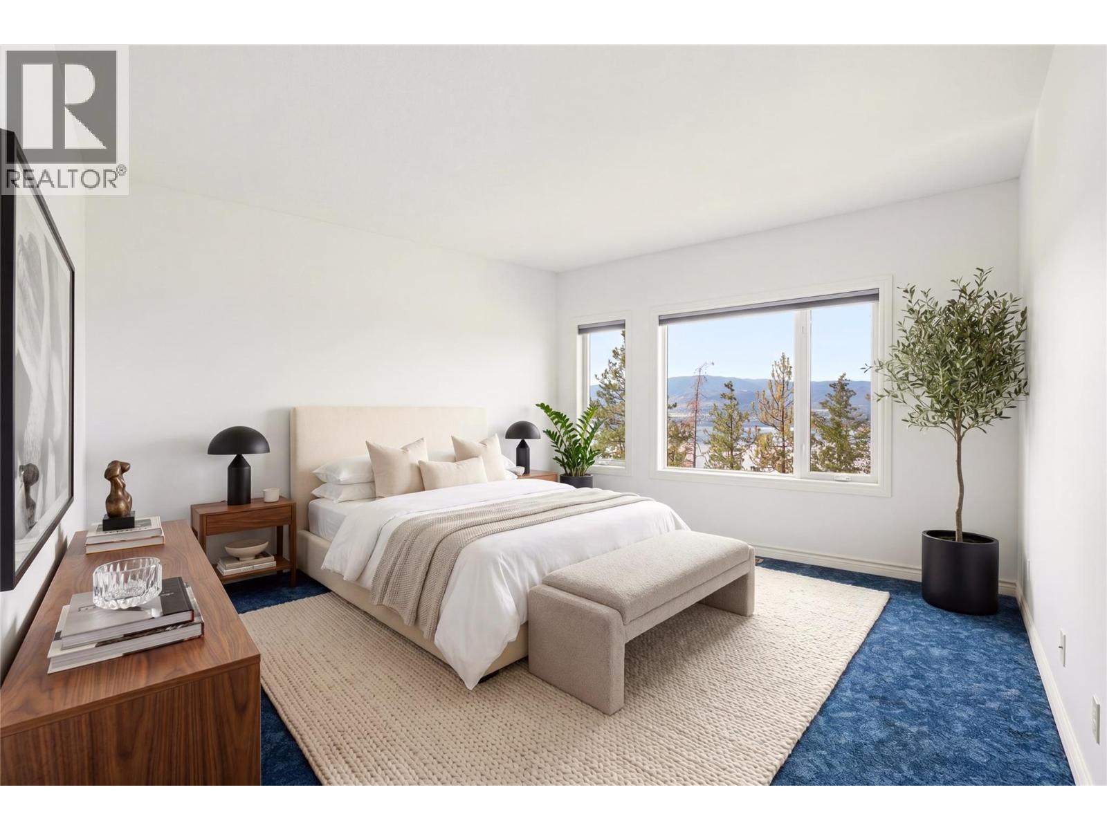 Primary bedroom- virtually staged with furniture - 448 Viewcrest Road, Kelowna, BC - Indoor Photo Showing Bedroom