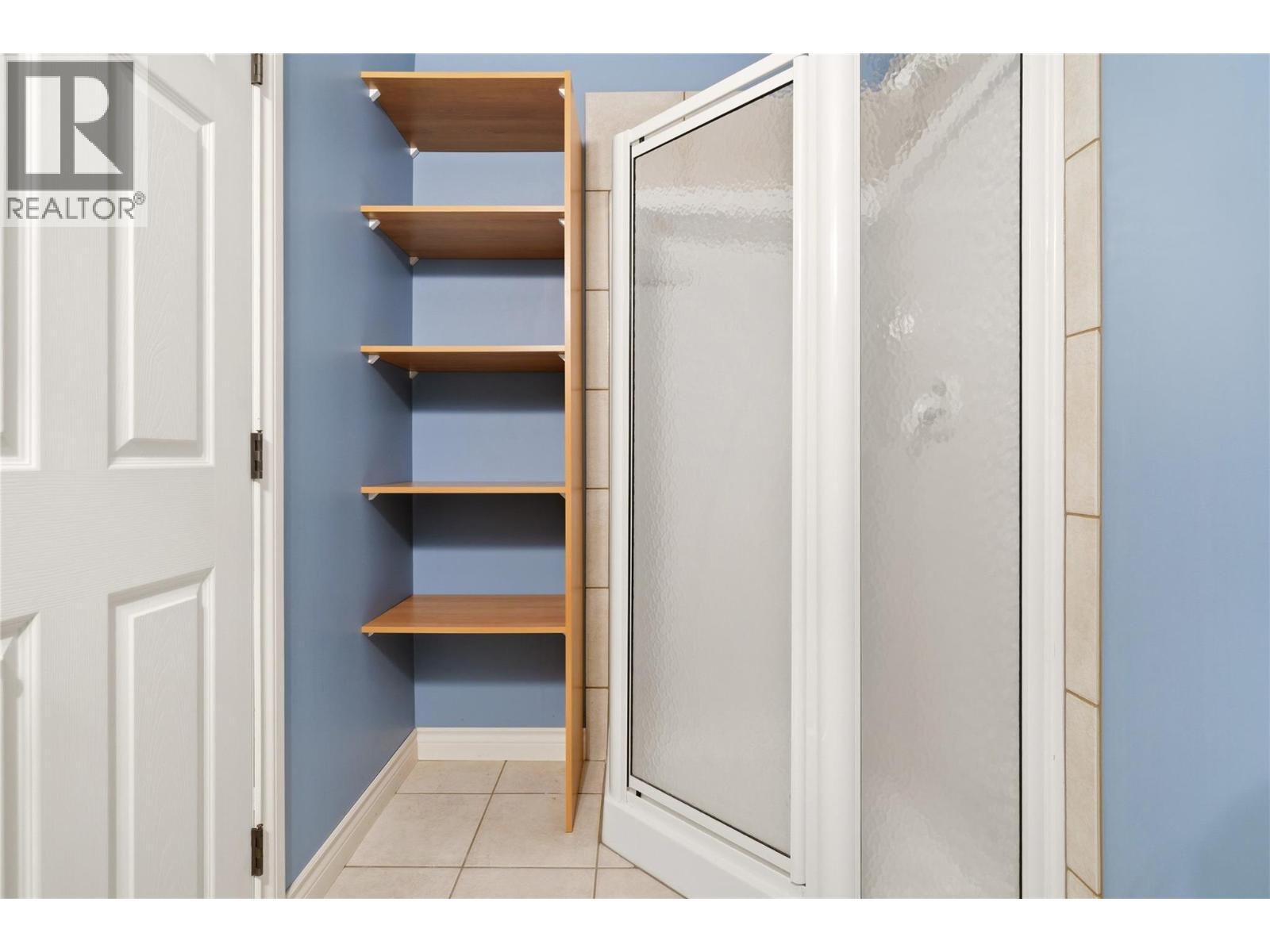 Lower level 3 piece bathroom with shower off the rec room - 448 Viewcrest Road, Kelowna, BC - Indoor
