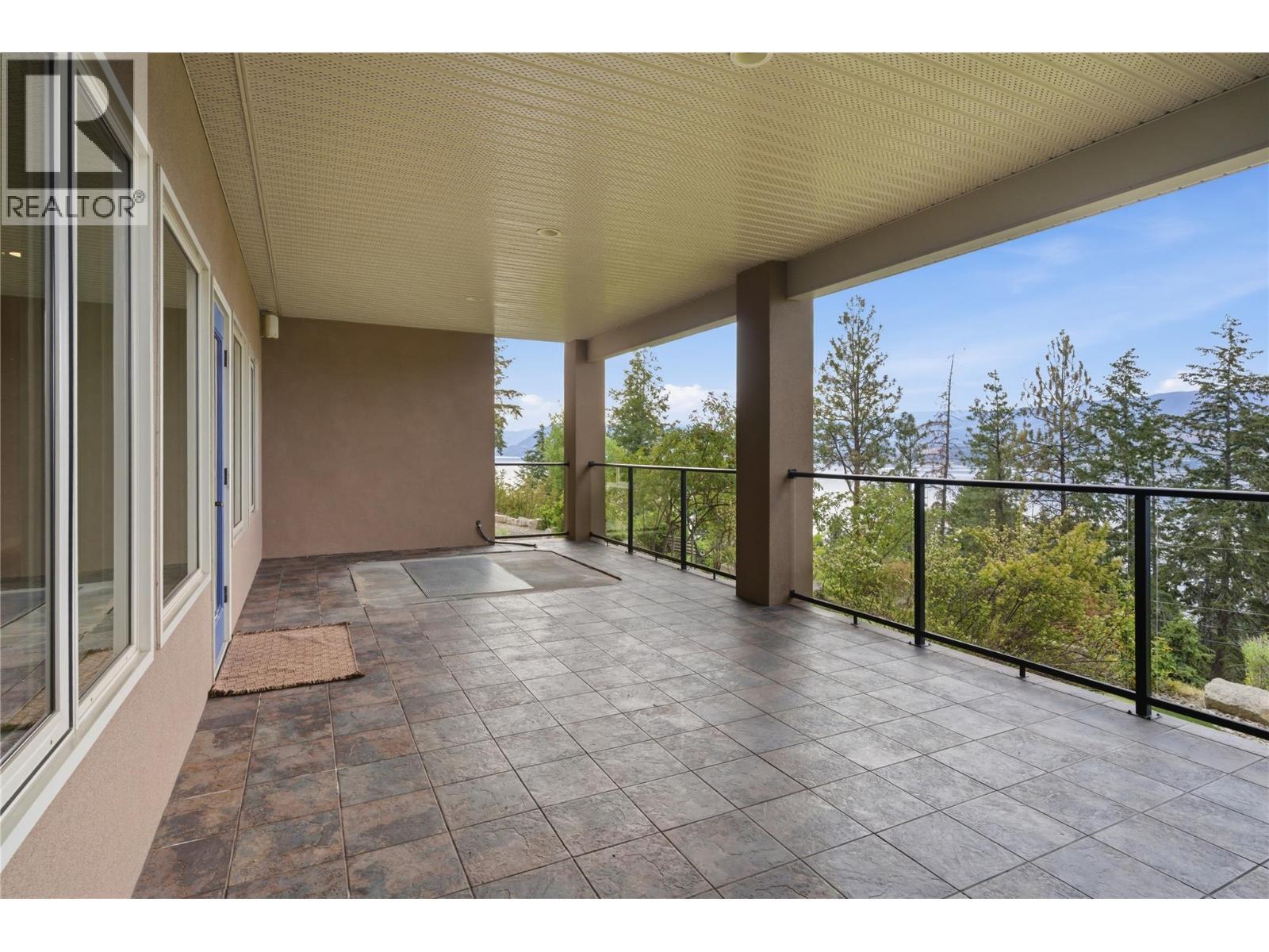 Lower level covered balcony- wired and ready for a hot tub! - 448 Viewcrest Road, Kelowna, BC - Outdoor With Balcony With Exterior