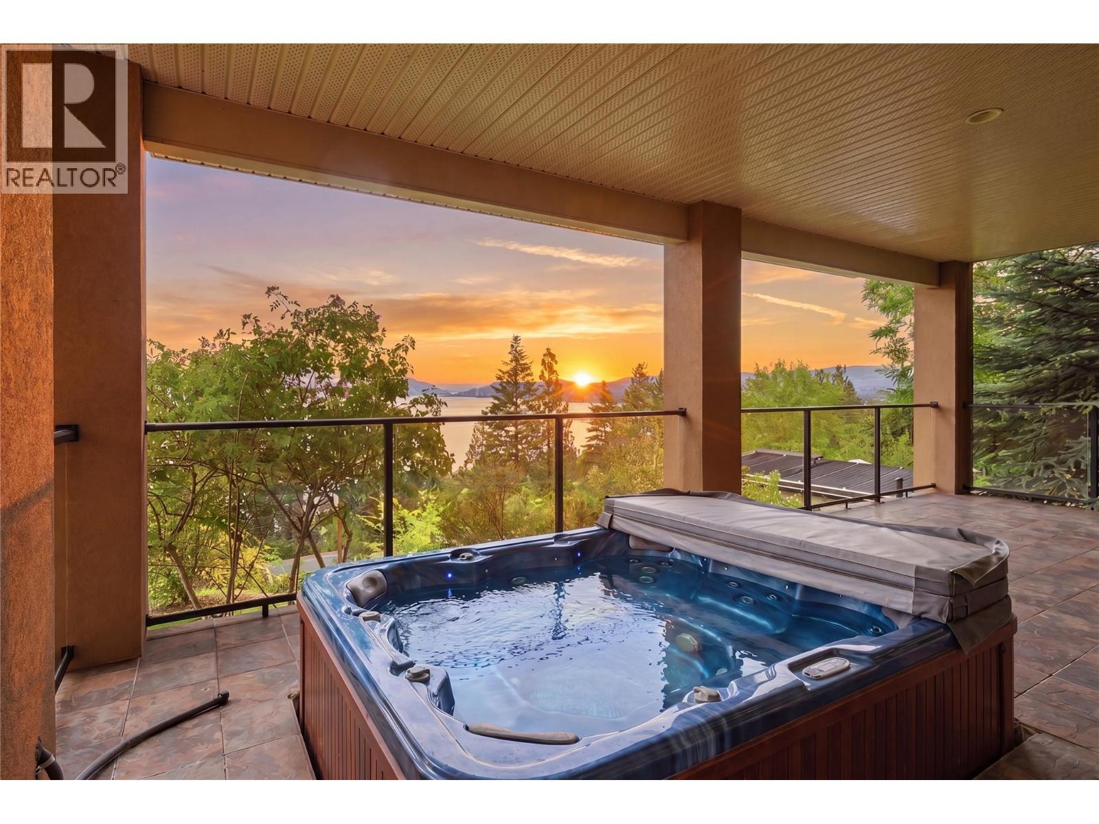 Staged photo of a hot tub on lower level balcony - 448 Viewcrest Road, Kelowna, BC - Outdoor With Balcony With Exterior