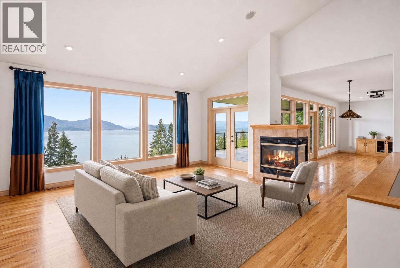 Living room- virtually staged furniture - 448 Viewcrest Road, Kelowna, BC - Indoor Photo Showing Living Room With Fireplace