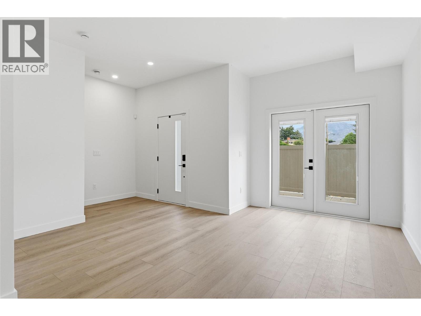 Additional rec room on the ground/lower floor with walk-out access - 4601 97 Street Unit# 6, Osoyoos, BC - Indoor Photo Showing Other Room