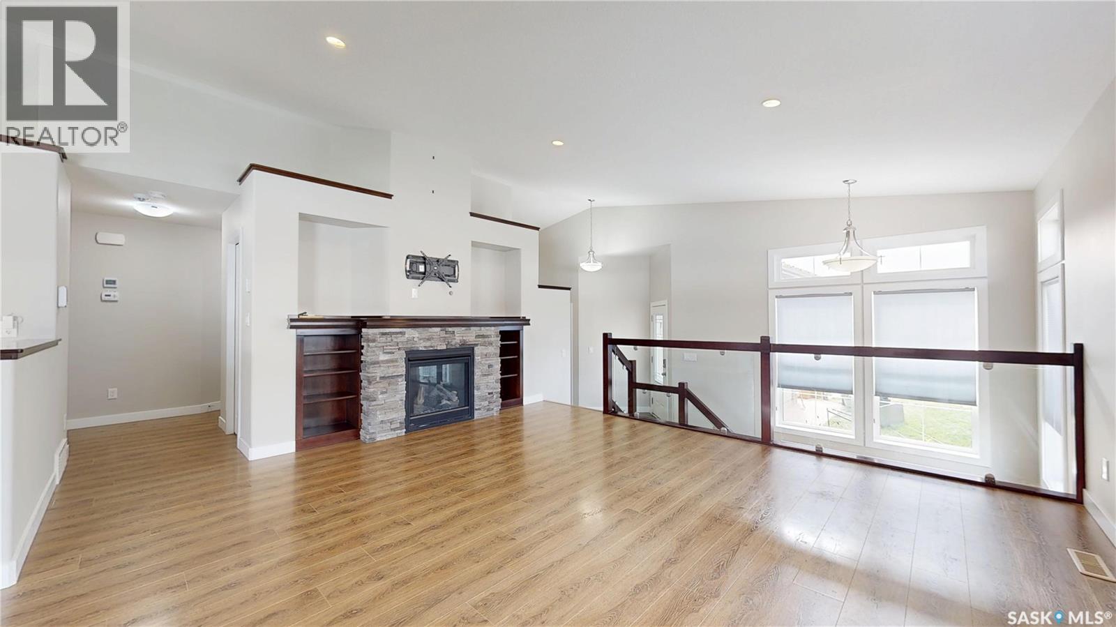 5614 Beacon Place, Regina, SK - Indoor Photo Showing Living Room With Fireplace