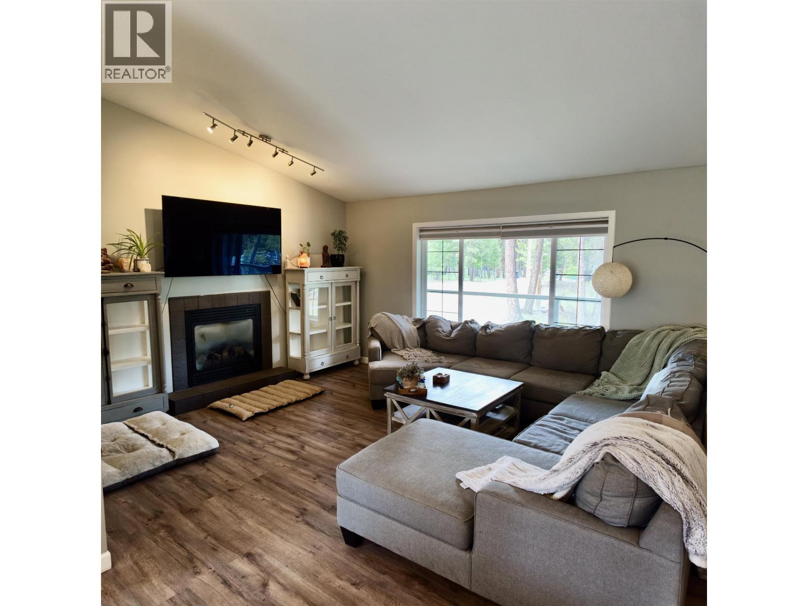 4838 Kitwanga Drive, 108 Mile Ranch, BC - Indoor Photo Showing Living Room With Fireplace