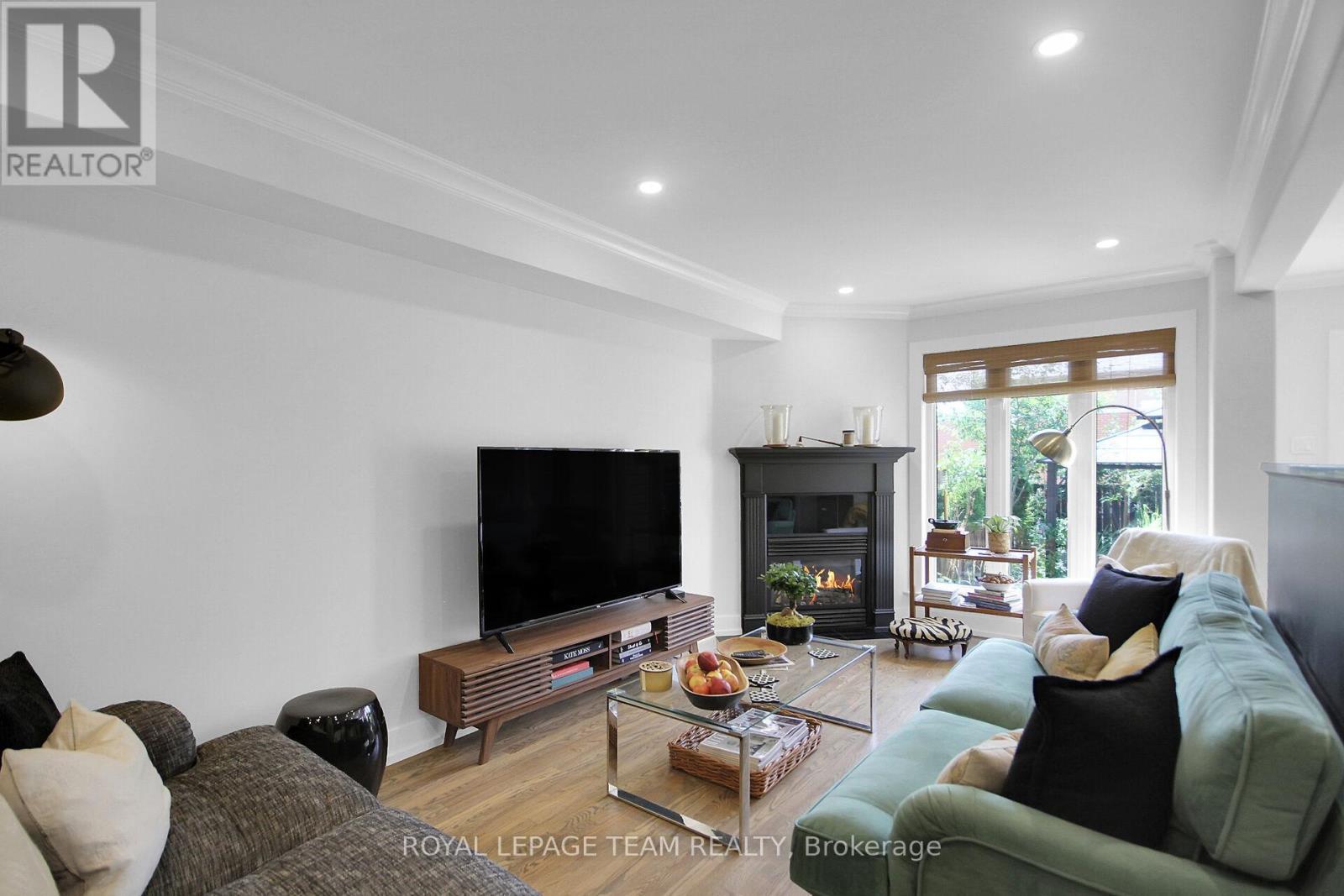 112 Talltree Crescent, Ottawa, ON - Indoor Photo Showing Living Room With Fireplace