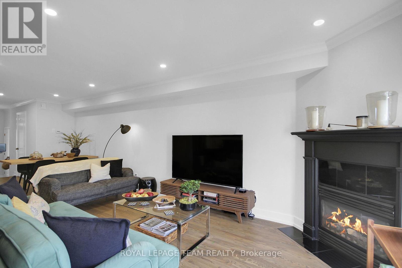 112 Talltree Crescent, Ottawa, ON - Indoor Photo Showing Living Room With Fireplace