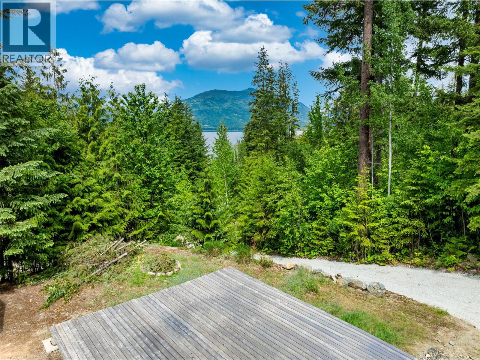 North facing lake and mountain view, view would increase if there was a 2 story home built here. - 3950 Short Road, Eagle Bay, BC