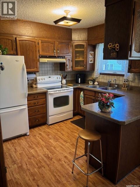 149 Garvin Crescent, Canora, SK - Indoor Photo Showing Kitchen With Double Sink