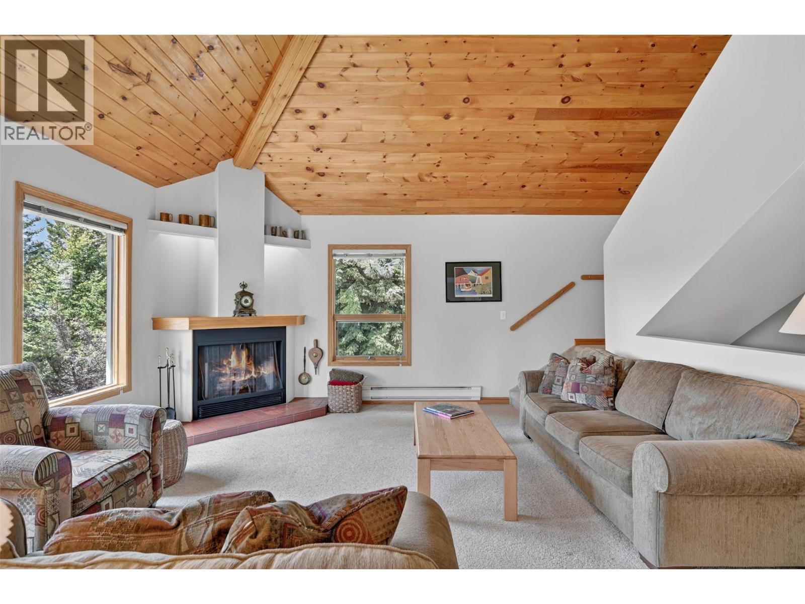 1067 Timberhill Place, Windermere, BC - Indoor Photo Showing Living Room With Fireplace