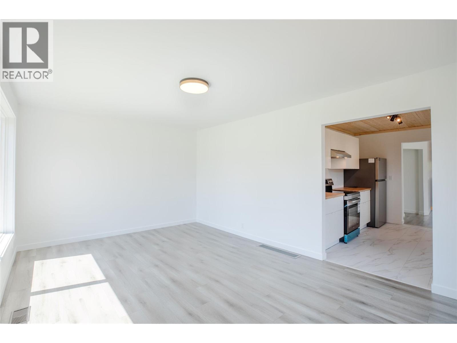Living Room to Kitchen - 710 Devon Street, Creston, BC - Indoor Photo Showing Other Room