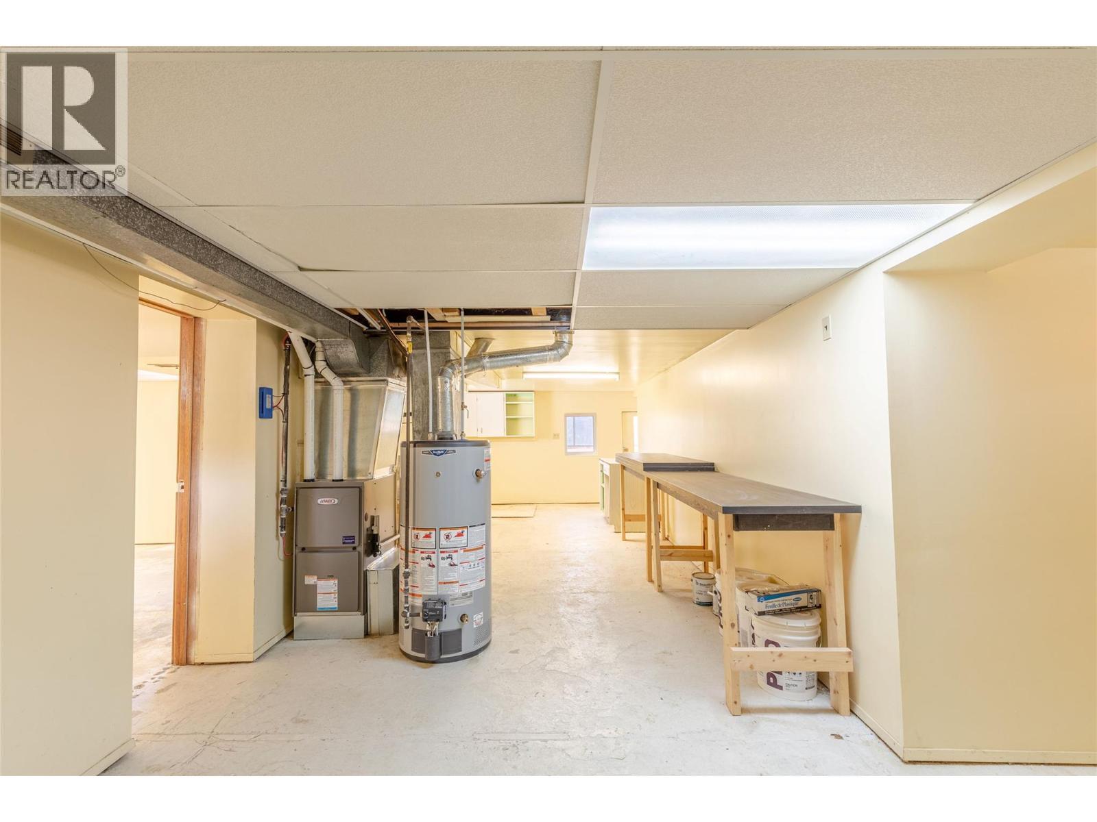 New Gas Furnace and Gas Hot Water Tank - 710 Devon Street, Creston, BC - Indoor Photo Showing Basement
