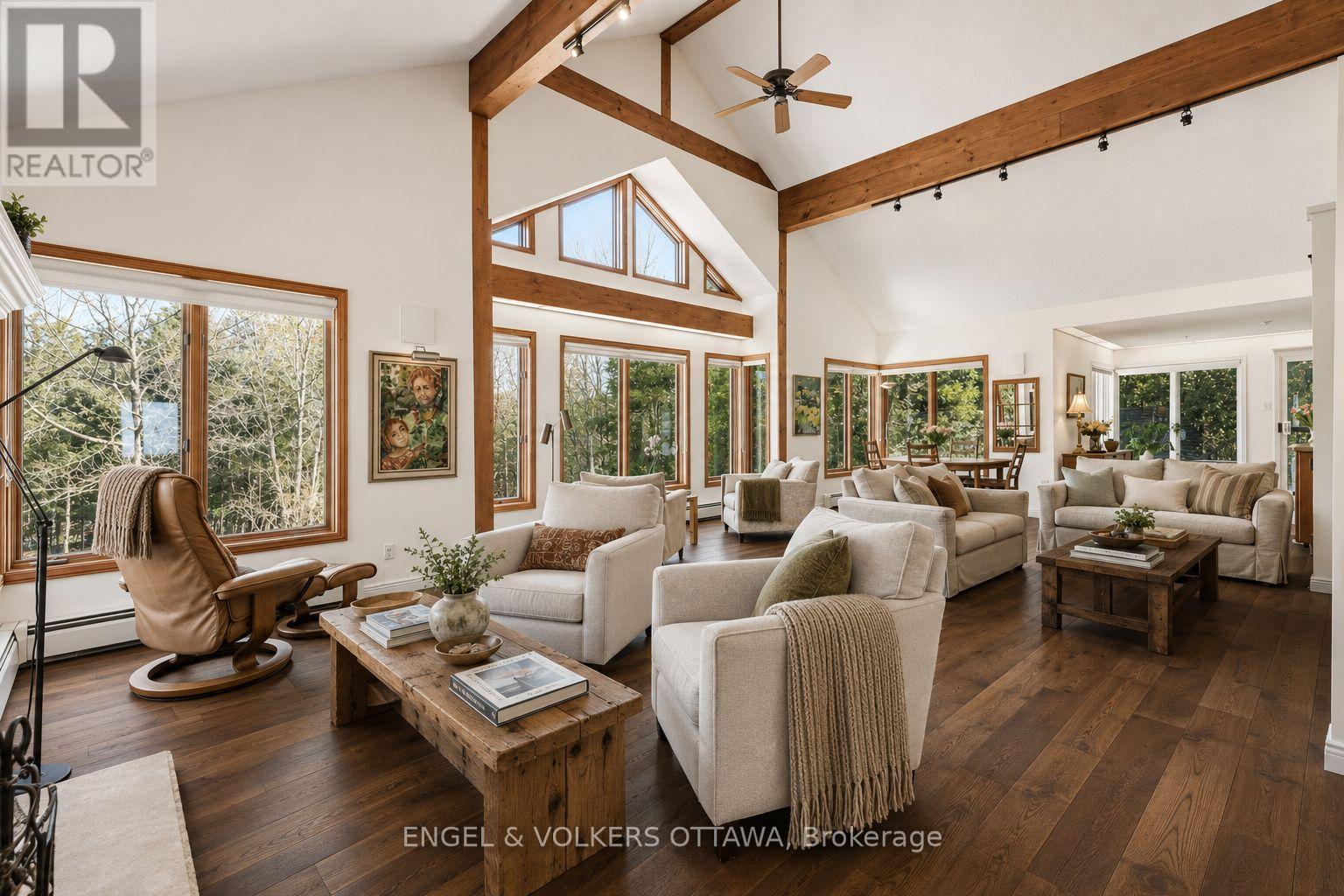 Virtually staged with hardwood (estimate on file) - 4637 Northwoods Drive, Ottawa, ON - Indoor Photo Showing Living Room