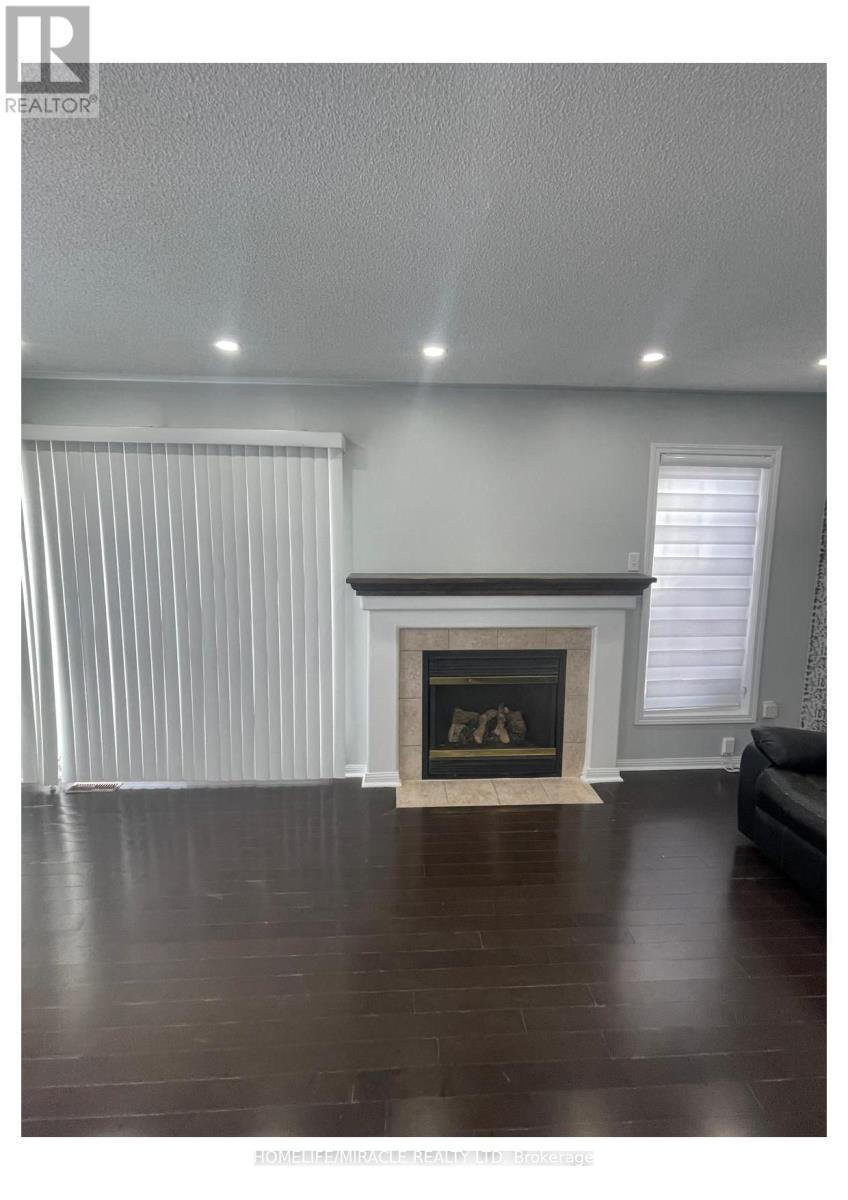 55 Secord Crescent, Brampton, ON - Indoor Photo Showing Living Room With Fireplace