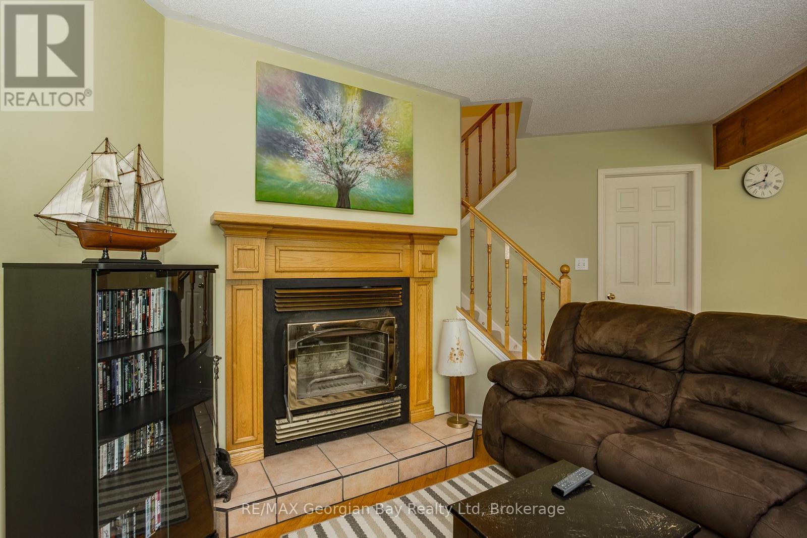 Living Room - 2 Ridout Court, Tiny, ON - Indoor Photo Showing Living Room With Fireplace
