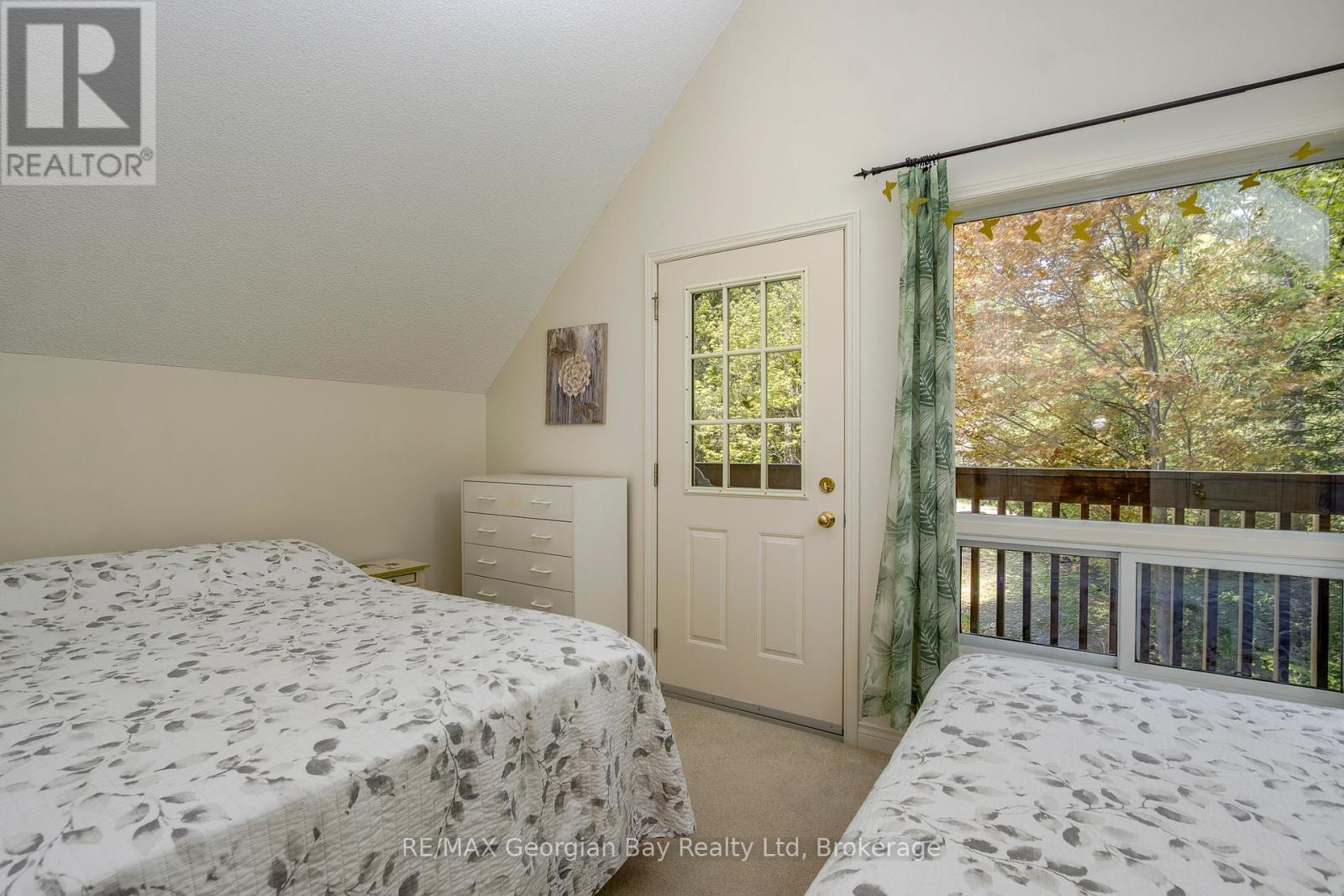 Walk Out to Balcony - 2 Ridout Court, Tiny, ON - Indoor Photo Showing Bedroom