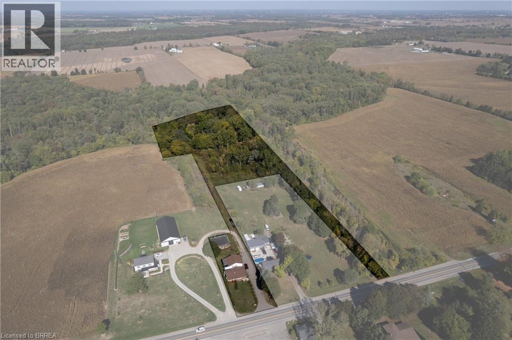 Expansive acreage featuring wooded areas and open fields - 206 King Street, Burford, ON - Outdoor With View