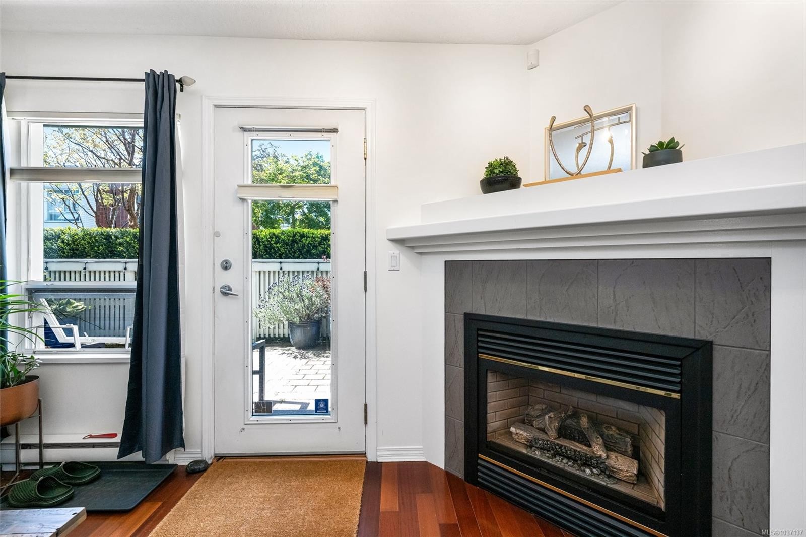 #109-380 Waterfront Cres, Victoria, BC - Indoor Photo Showing Living Room With Fireplace