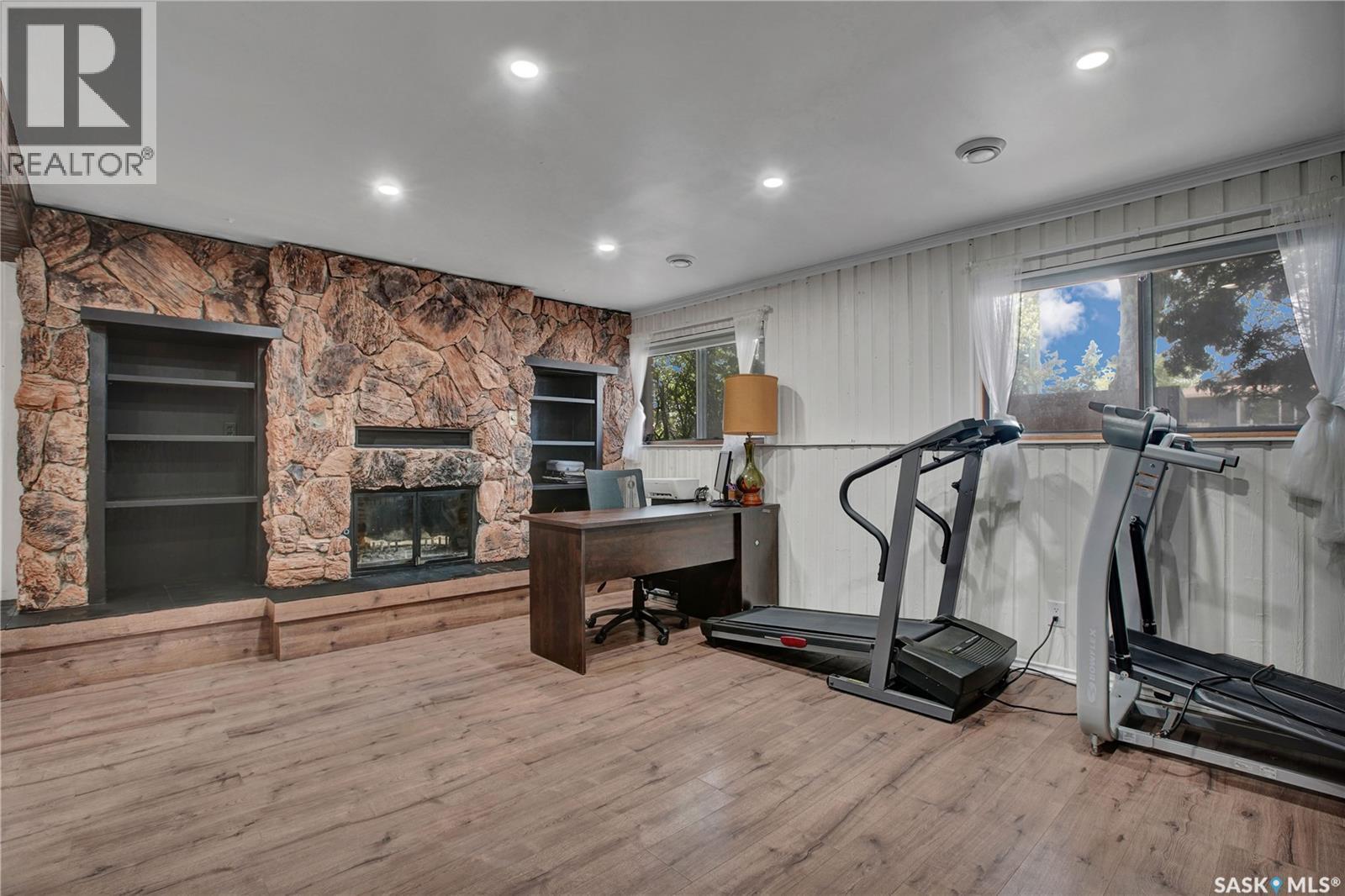 3831 Taylor Street E, Saskatoon, SK - Indoor Photo Showing Gym Room With Fireplace