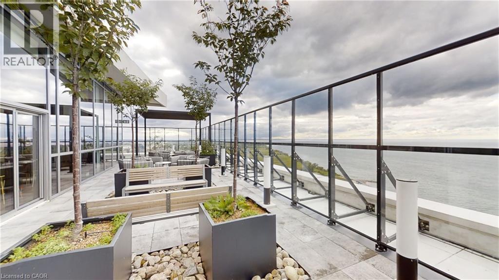 Common area offers a gorgeous terrace with a view of Lake Ontario - 385 Winston Road Unit# 709, Grimsby, ON - With Body Of Water