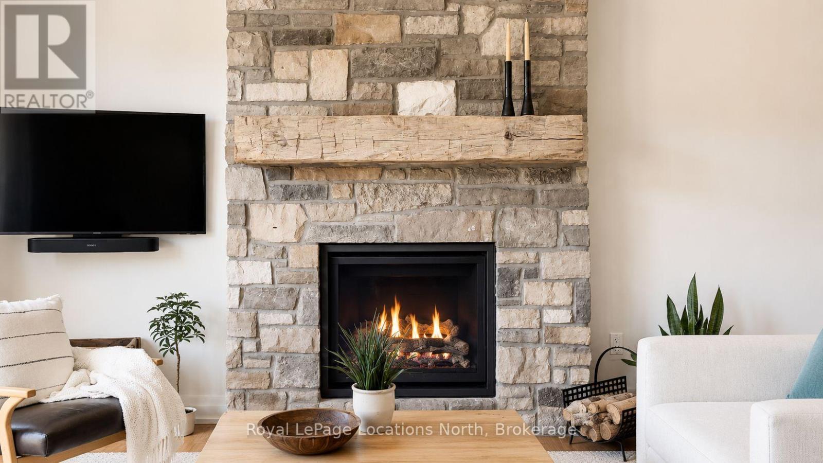 Family Room Fireplace - 70 Plewes Drive, Collingwood, ON - Indoor Photo Showing Living Room With Fireplace