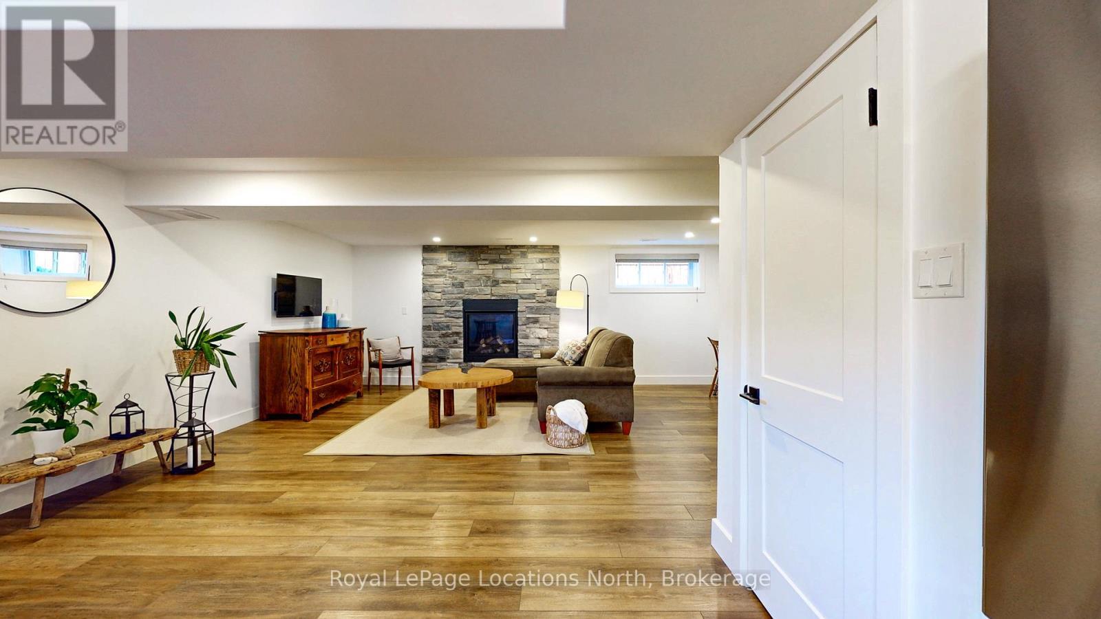 Basement Living Room - 70 Plewes Drive, Collingwood, ON - Indoor With Fireplace