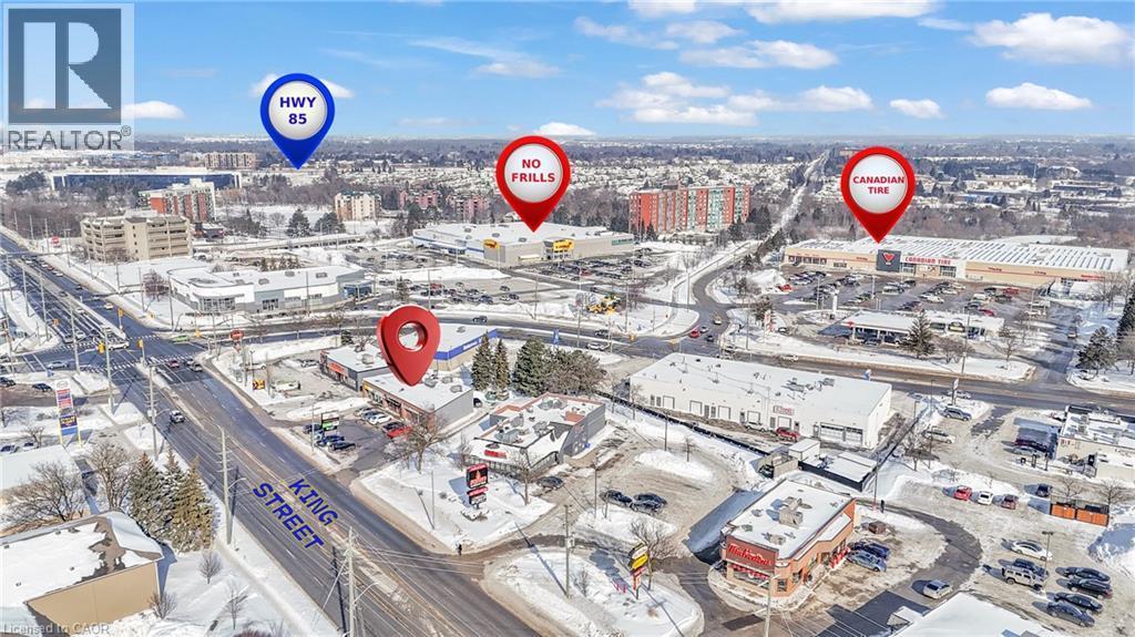 Aerial view showcasing proximity to major thoroughfares and retail establishments - 402 King Street N, Waterloo, ON