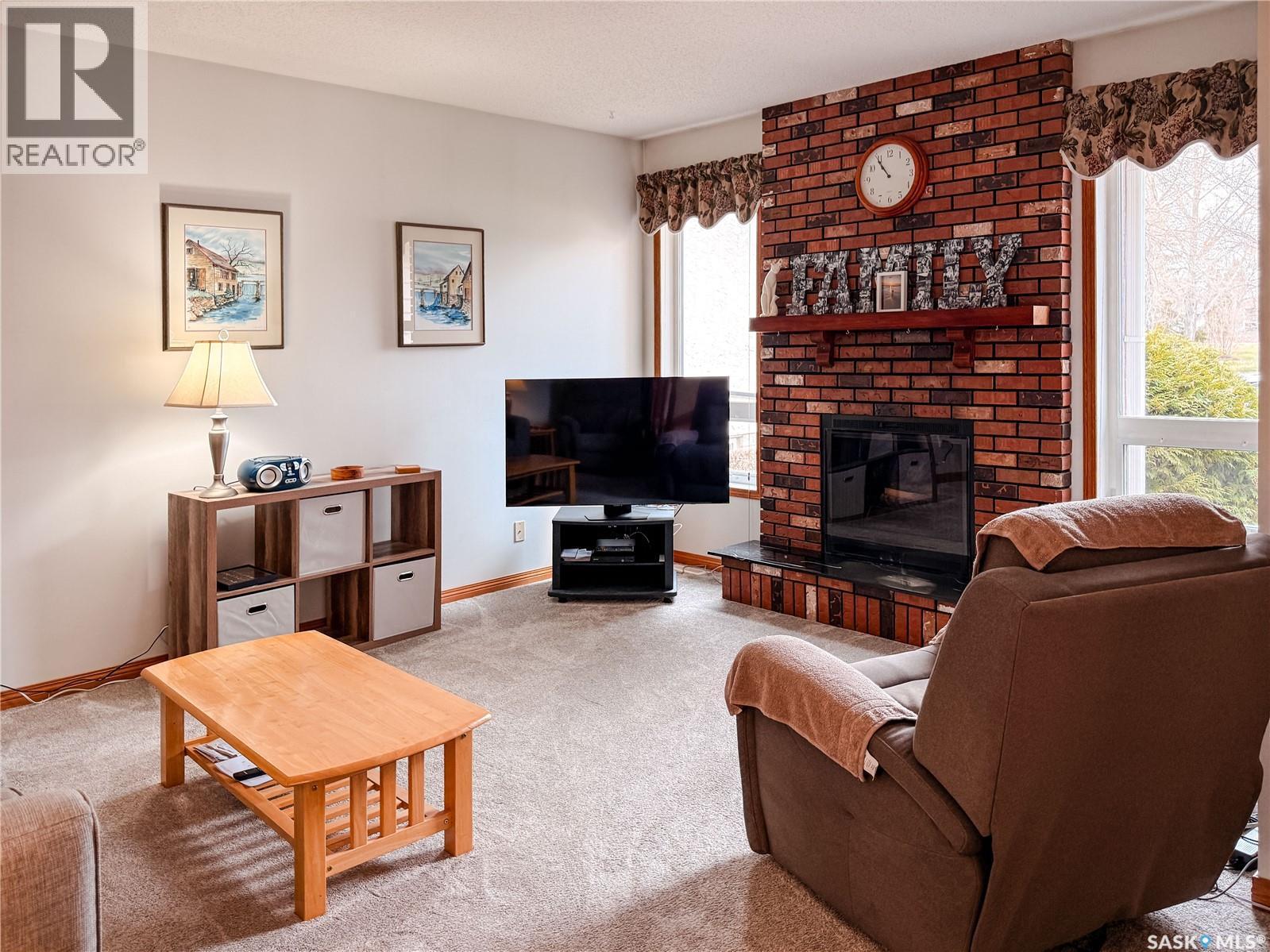 95 Pappas Crescent, Regina, SK - Indoor Photo Showing Living Room With Fireplace