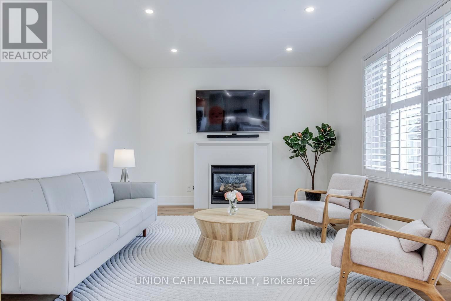 69 Southbrook Crescent, Markham, ON - Indoor Photo Showing Living Room With Fireplace