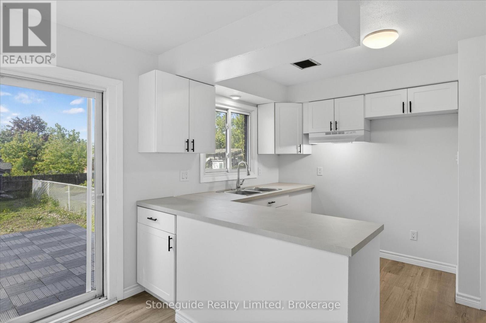 667 Skyline Road, Selwyn, ON - Indoor Photo Showing Kitchen With Double Sink