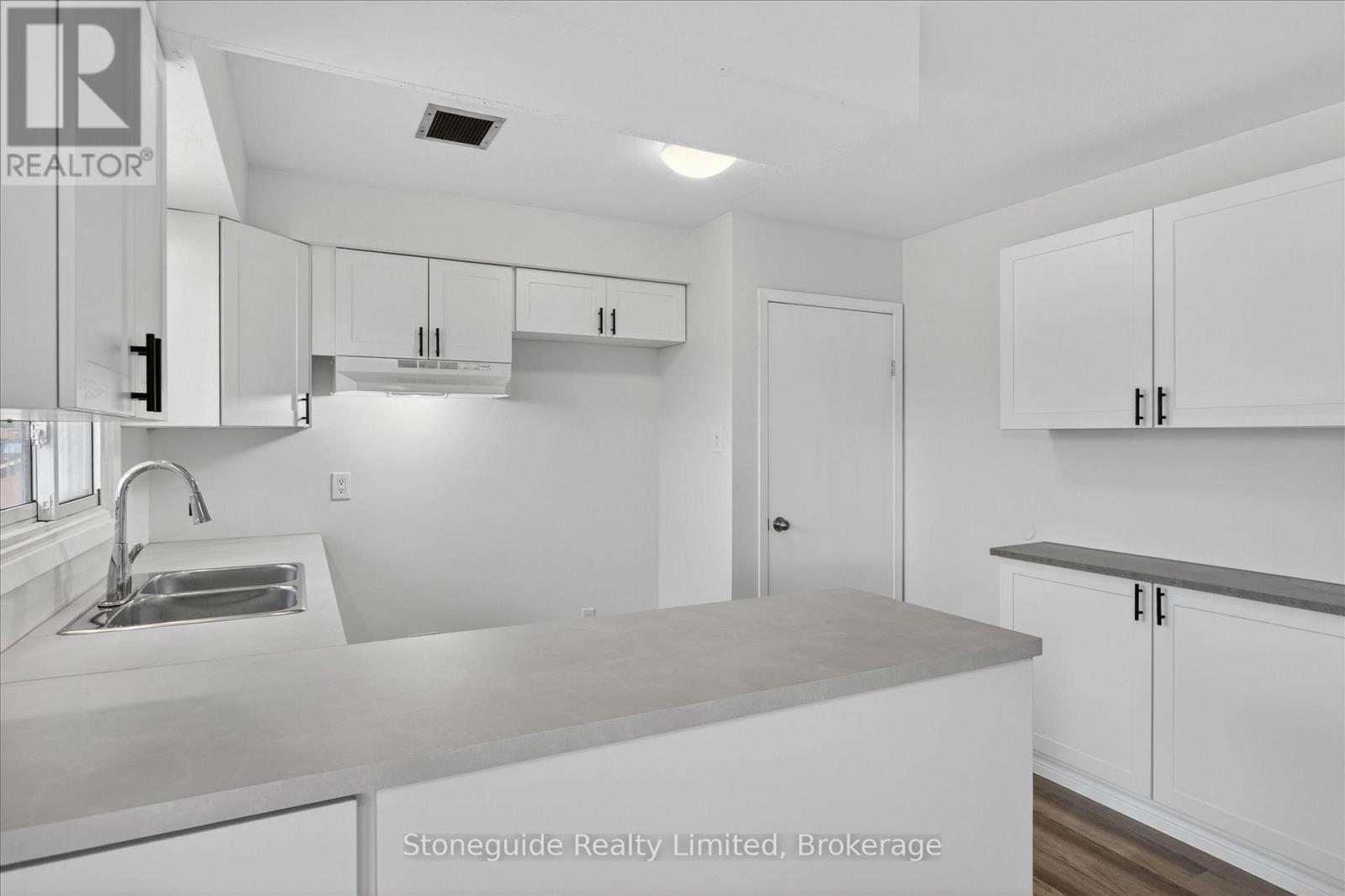 667 Skyline Road, Selwyn, ON - Indoor Photo Showing Kitchen With Double Sink
