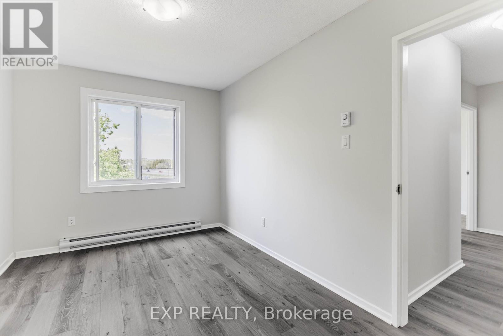 All new Baseboard Heaters - Thermostats! - 404 B - 2044 Arrowsmith Drive, Ottawa, ON - Indoor Photo Showing Other Room