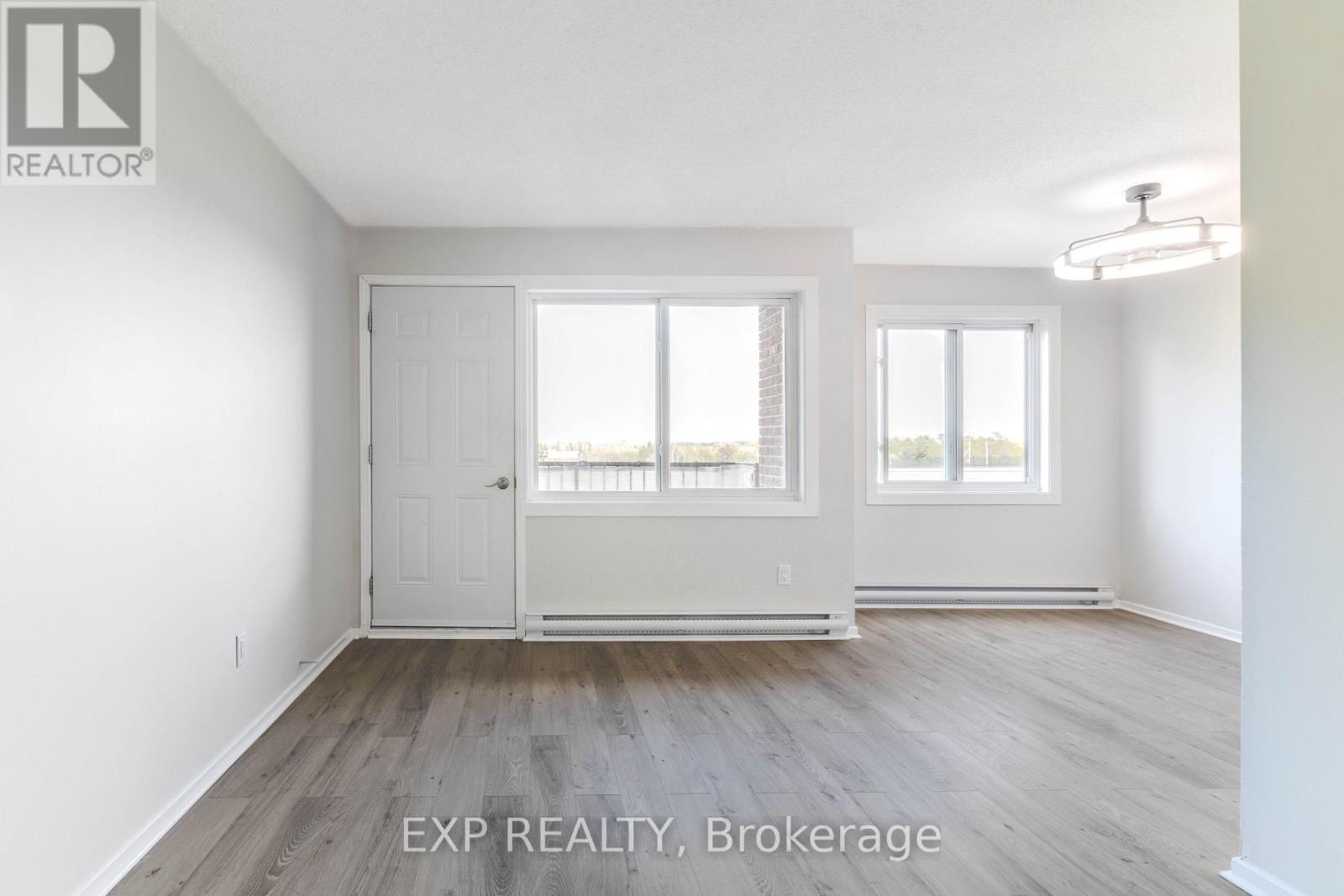 Balcony Entrance from the Living Room! - 404 B - 2044 Arrowsmith Drive, Ottawa, ON - Indoor Photo Showing Other Room