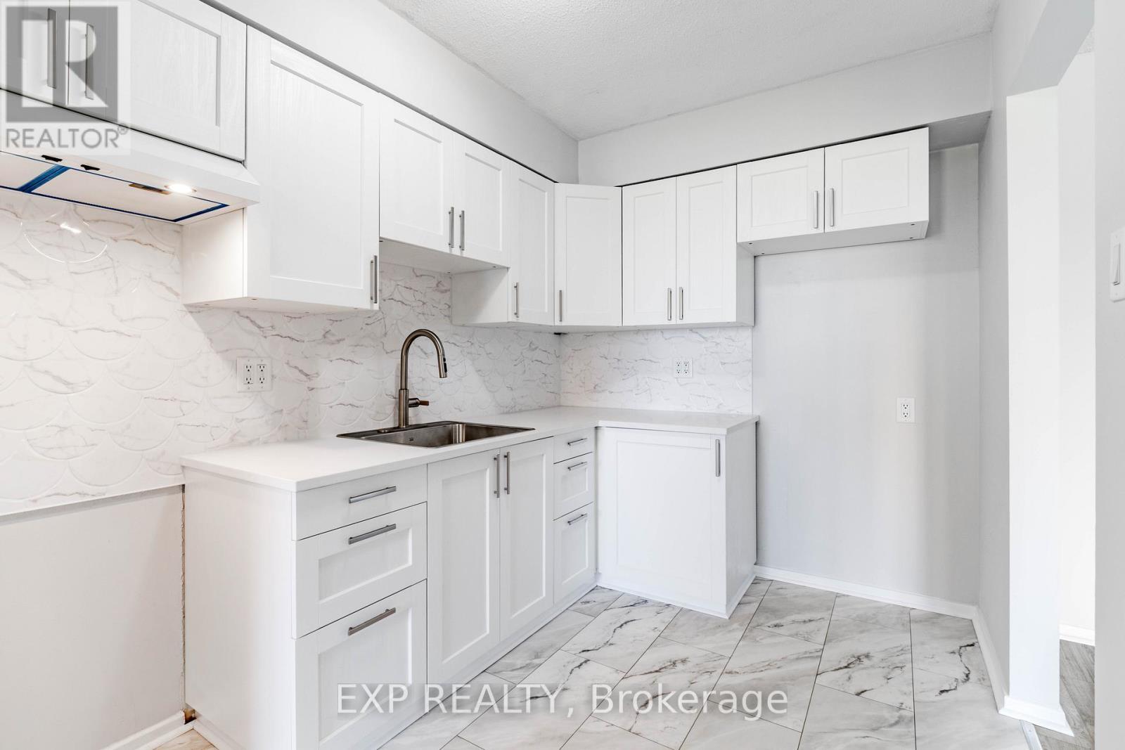 New -Cabinets - Floor - Fish Scale Tile Backslash - 404 B - 2044 Arrowsmith Drive, Ottawa, ON - Indoor Photo Showing Kitchen