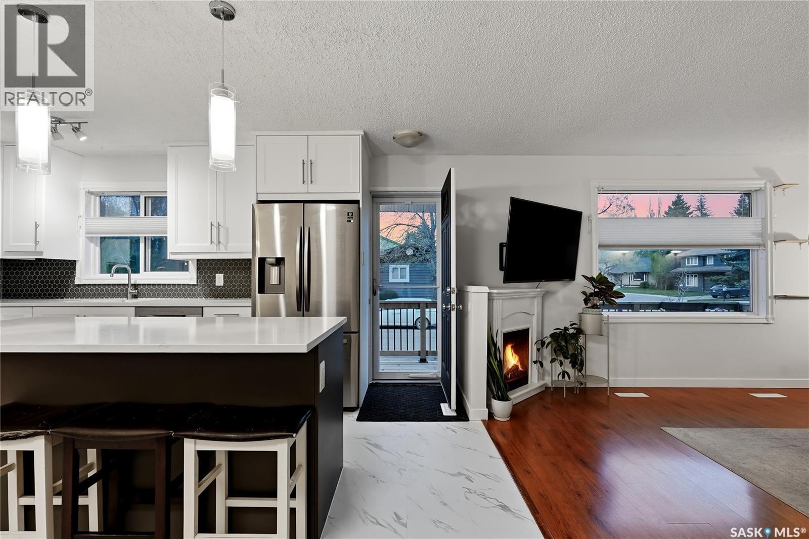 171 Coldspring Crescent, Saskatoon, SK - Indoor Photo Showing Kitchen With Fireplace With Stainless Steel Kitchen With Upgraded Kitchen