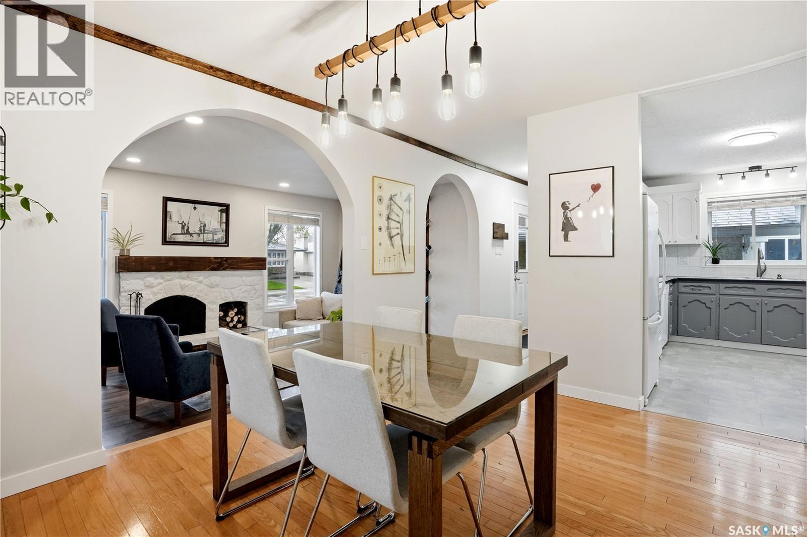14 Edenwold Crescent, Regina, SK - Indoor Photo Showing Dining Room With Fireplace
