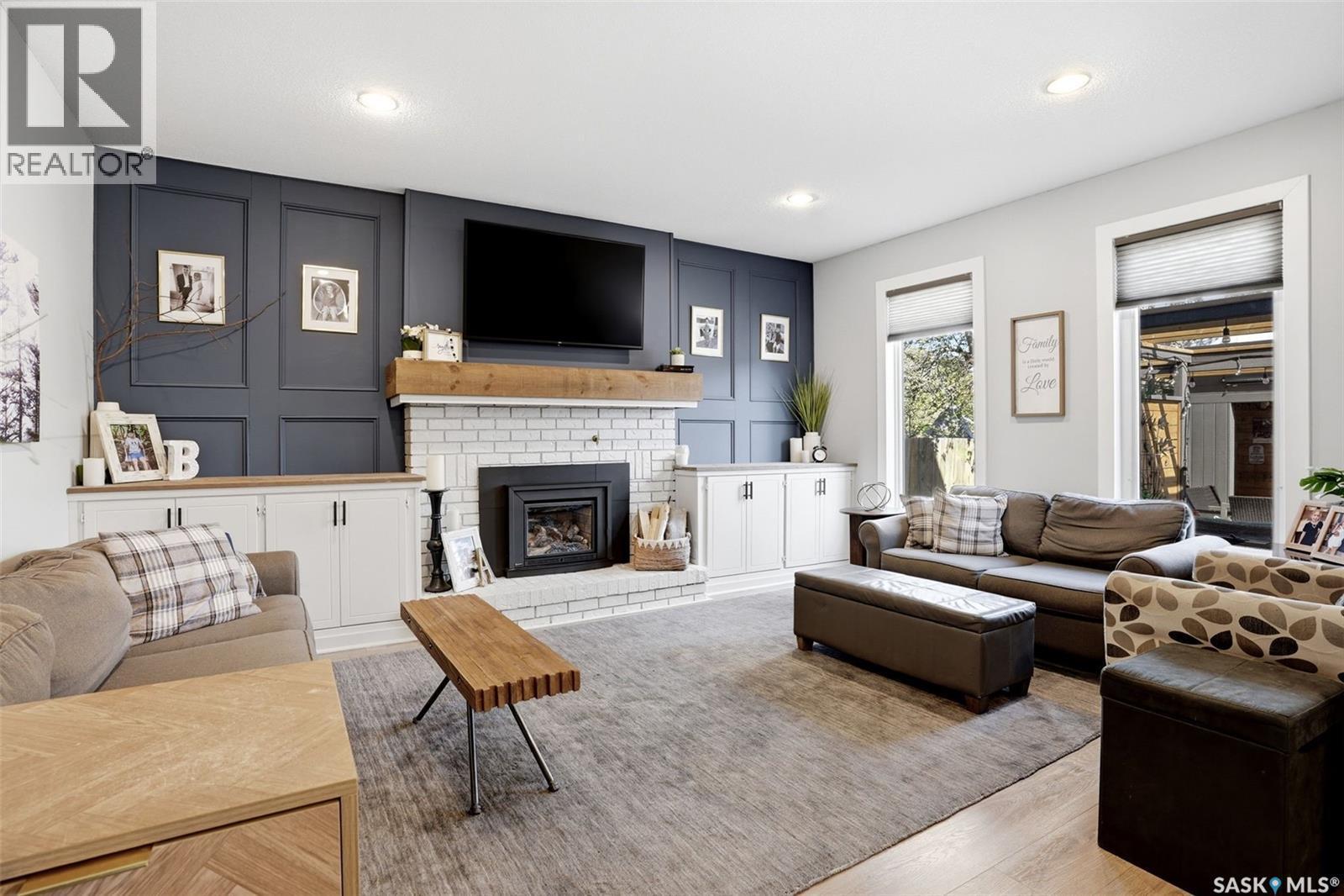 10 Louise Crescent, Regina, SK - Indoor Photo Showing Living Room With Fireplace