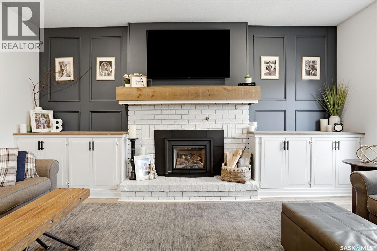10 Louise Crescent, Regina, SK - Indoor Photo Showing Living Room With Fireplace