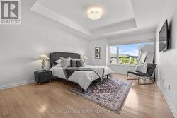 Primary bedroom with Hardwood floors -
