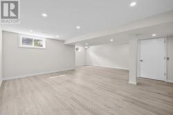Finished basement with pot lights -