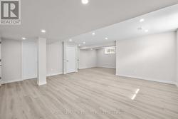 Finished basement with pot lights -