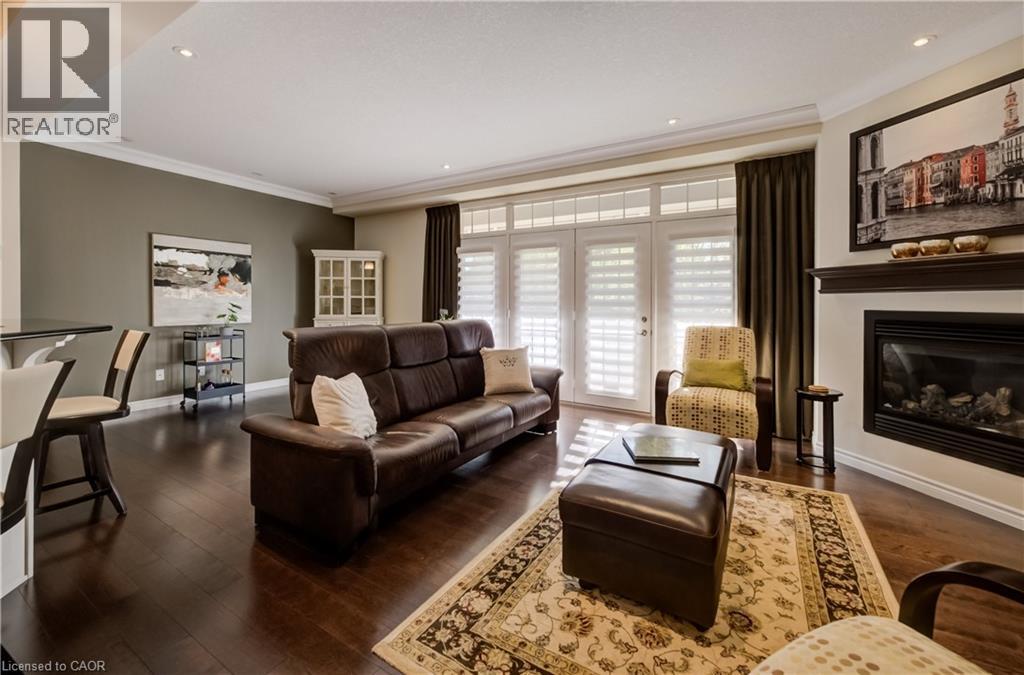 435 Winchester Drive Unit# 10, Waterloo, ON - Indoor Photo Showing Living Room With Fireplace