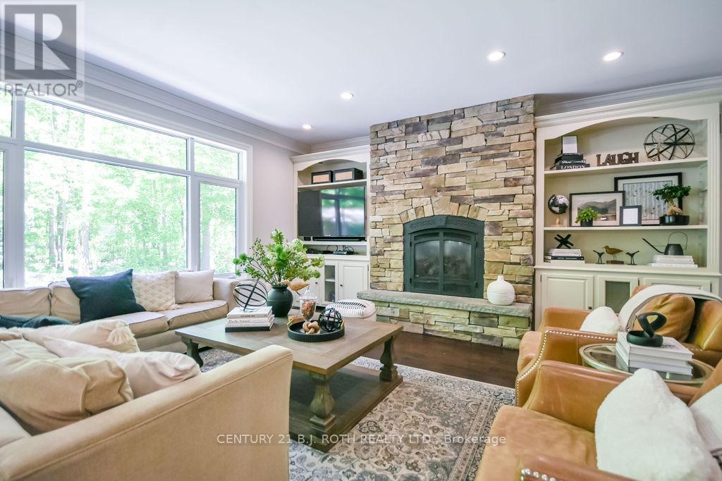 33 Reilly'S Run, Springwater, ON - Indoor Photo Showing Living Room With Fireplace