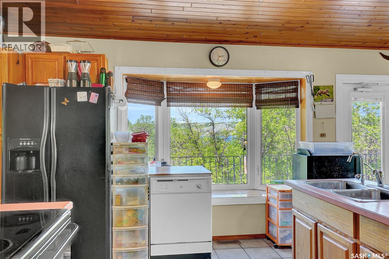 701 Tatanka Drive, Buffalo Pound Lake, SK - Indoor Photo Showing Kitchen With Double Sink