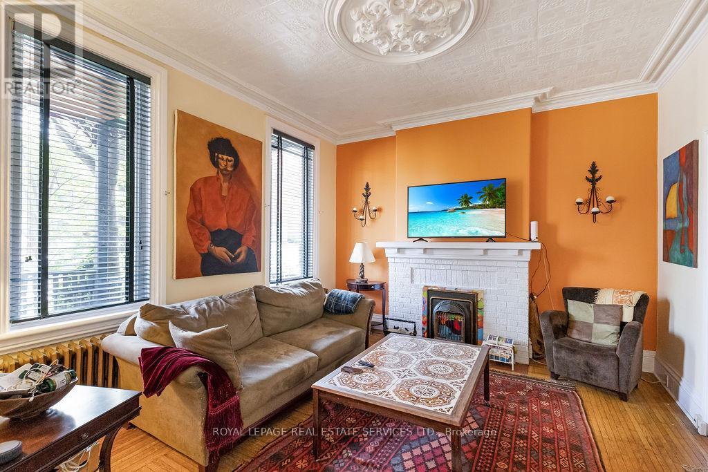 100 Wentworth Street S, Hamilton, ON - Indoor Photo Showing Living Room With Fireplace