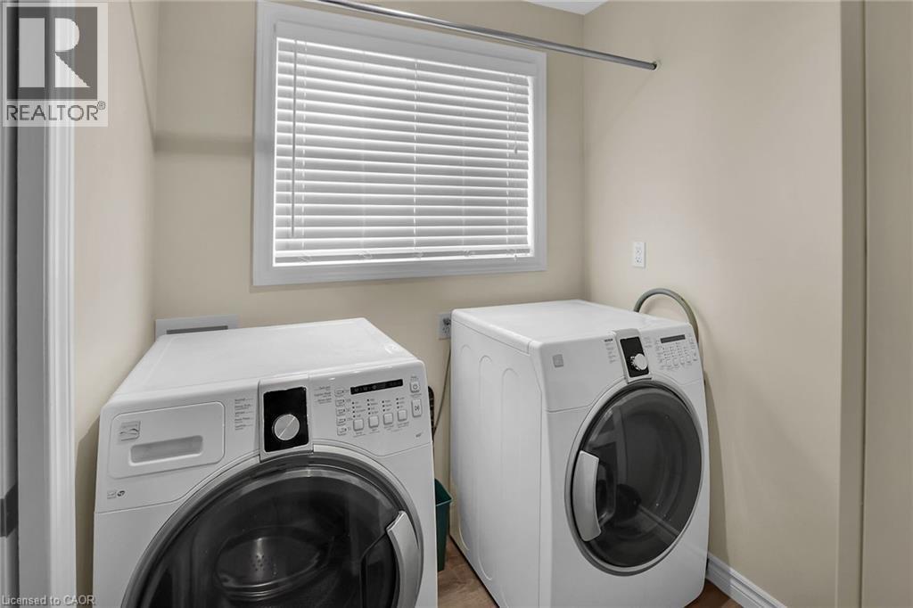 Laundry area with washer and dryer and closet - 4432 Dennis Avenue, Beamsville, ON - Indoor Photo Showing Laundry Room