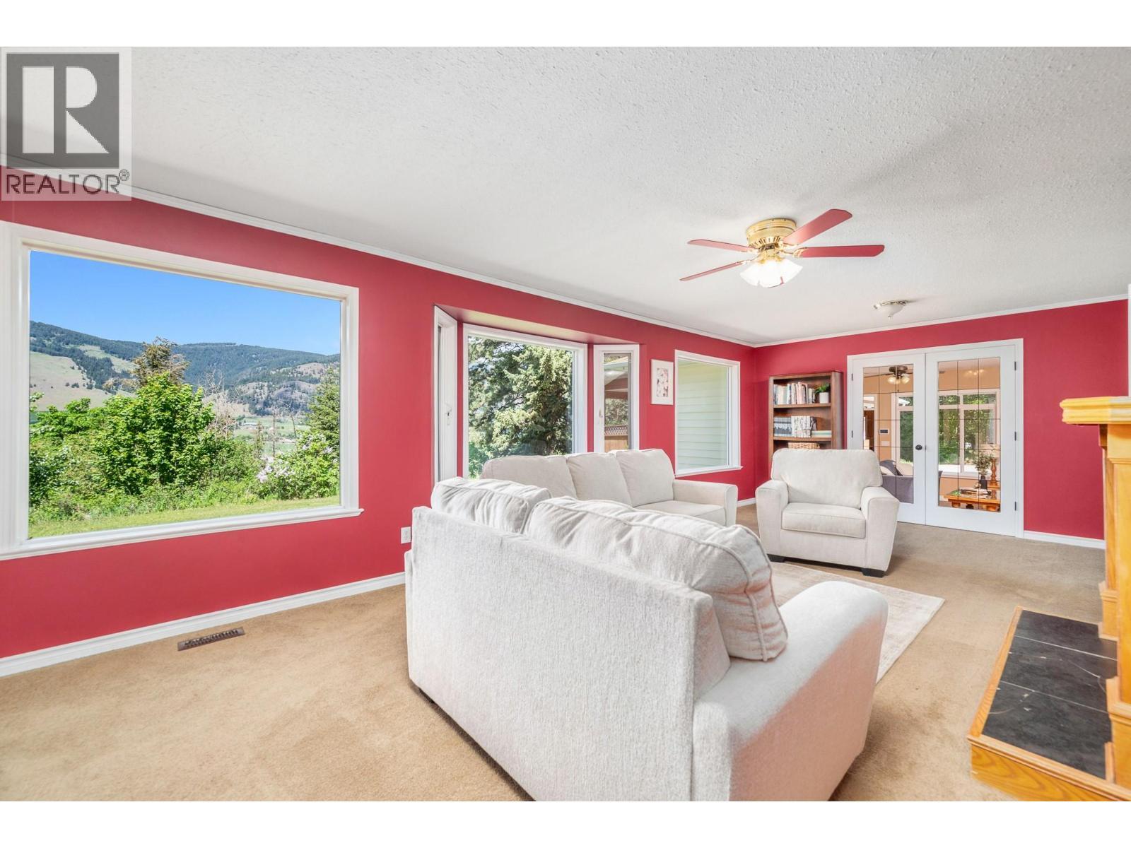 6960 Brewer Road, Coldstream, BC - Indoor Photo Showing Living Room With Fireplace