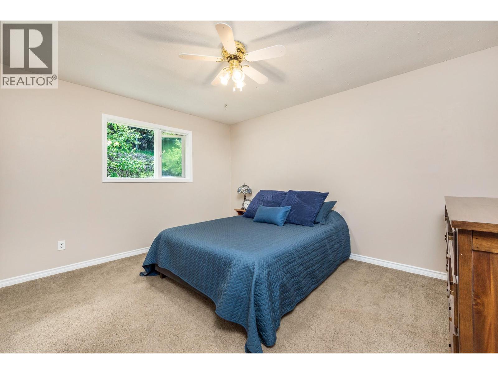 6960 Brewer Road, Coldstream, BC - Indoor Photo Showing Bedroom