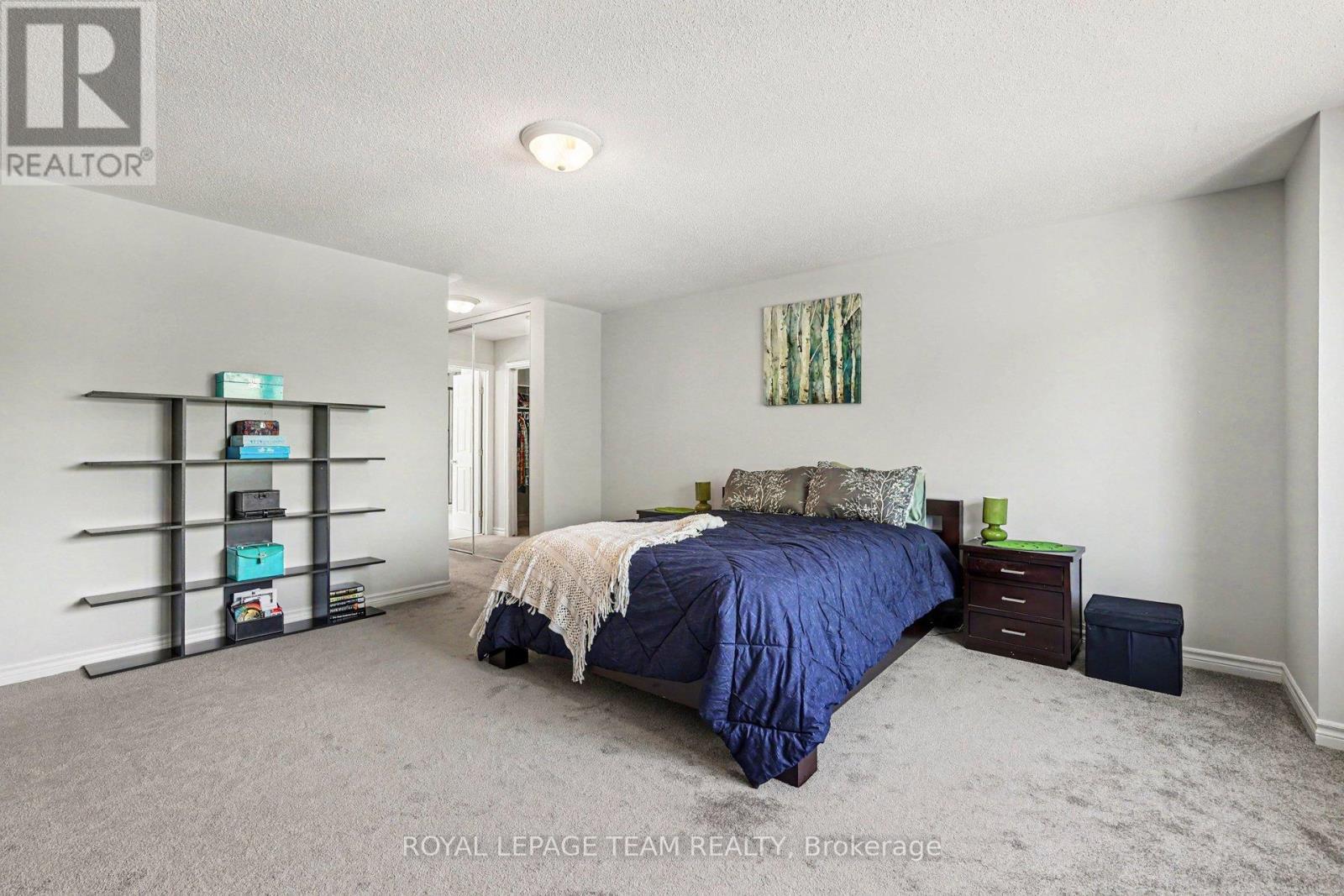 Primary Bed towards walk in and en suite - 65 Osprey Crescent, Ottawa, ON