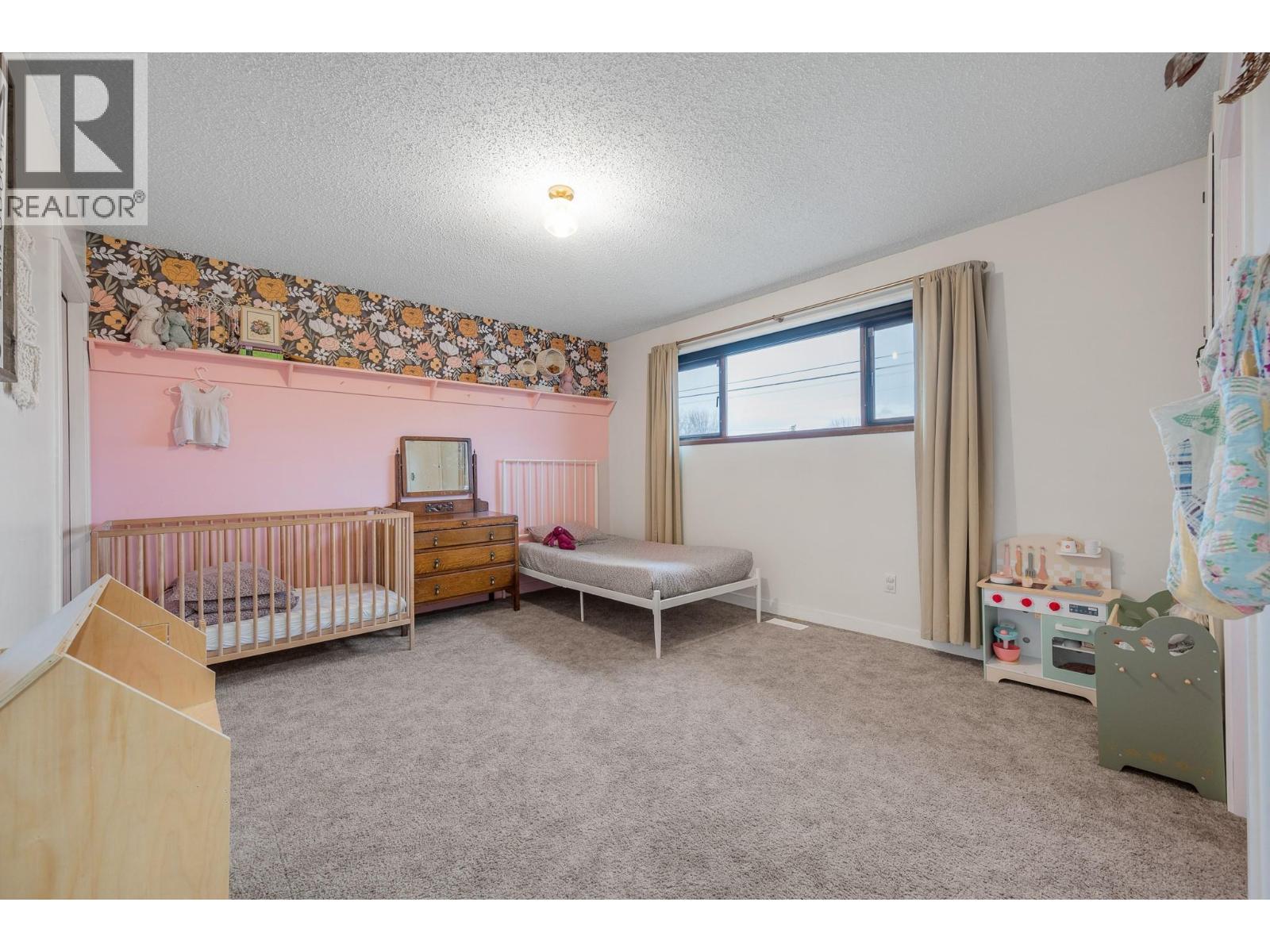 Main Home - Second Bedroom - 302 Bass Avenue, Enderby, BC - Indoor Photo Showing Bedroom